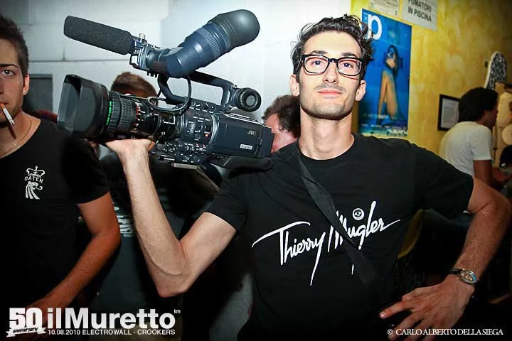 Marco Miraglia filming with a JVC camera at il Muretto for Electrowall with Crookers, 10 August 2010 — photo by Carlo Alberto Della Siega