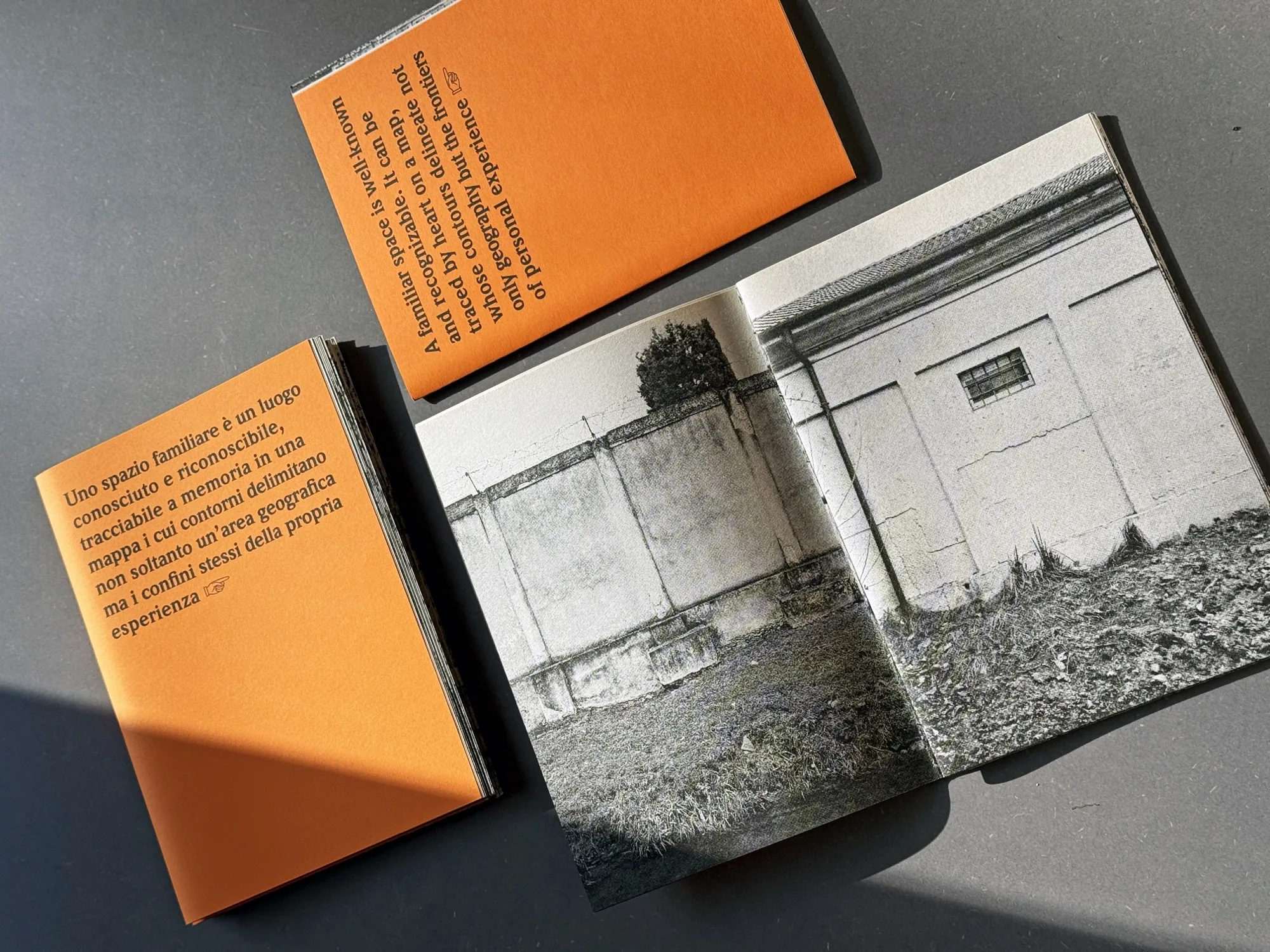 Military Area — risograph book spreads with orange covers and interior photograph